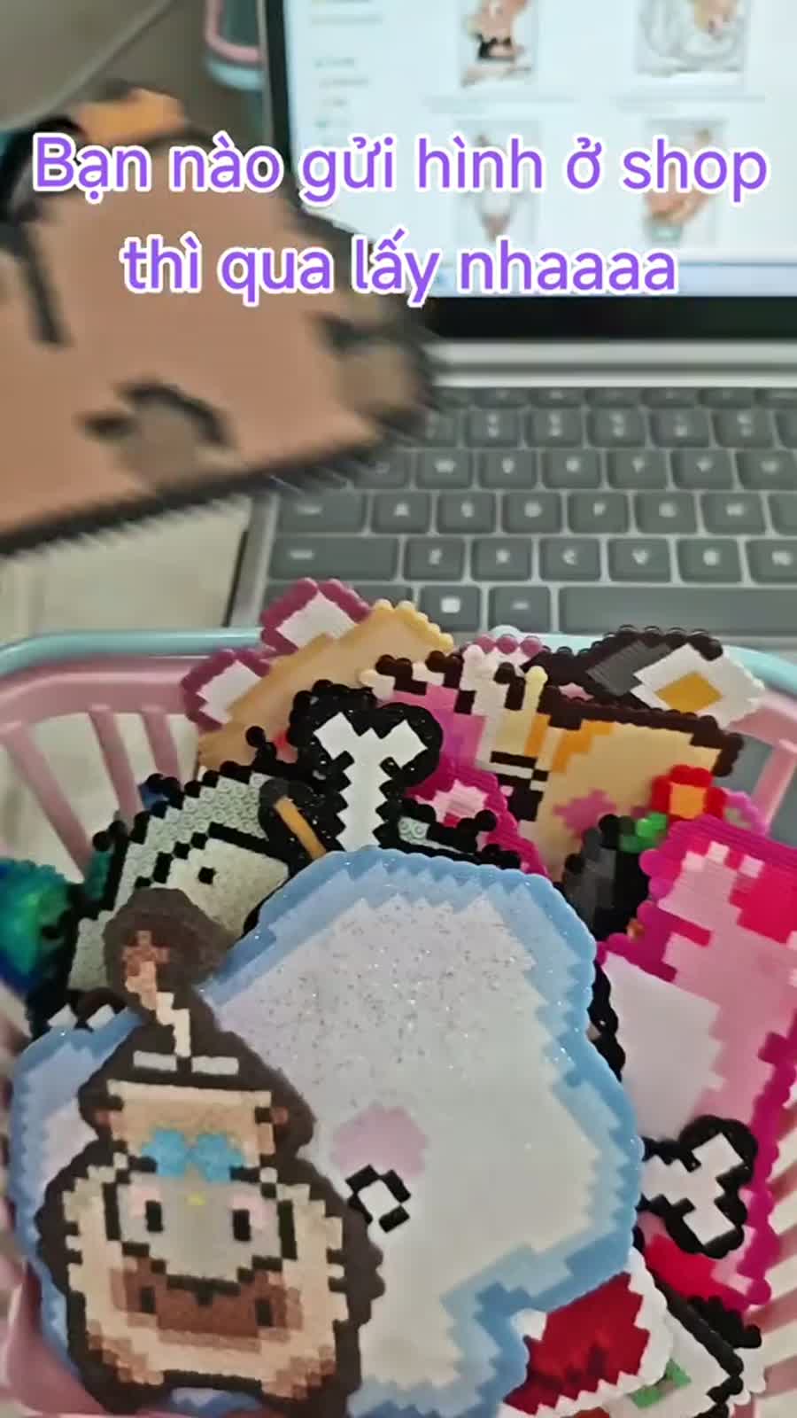 Finished pixel bead works collected in a basket